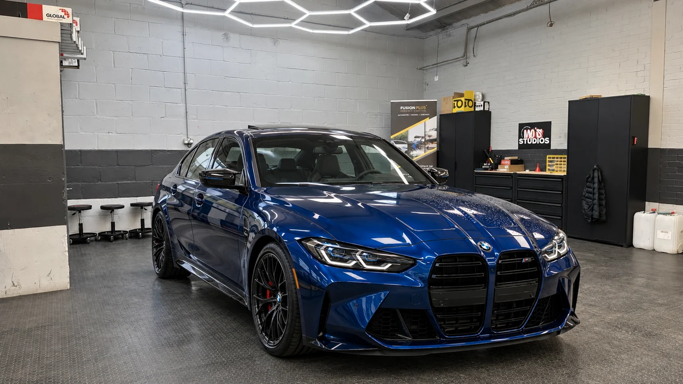 A blue BMW M car under the hexagon lighting in the Braintree studio