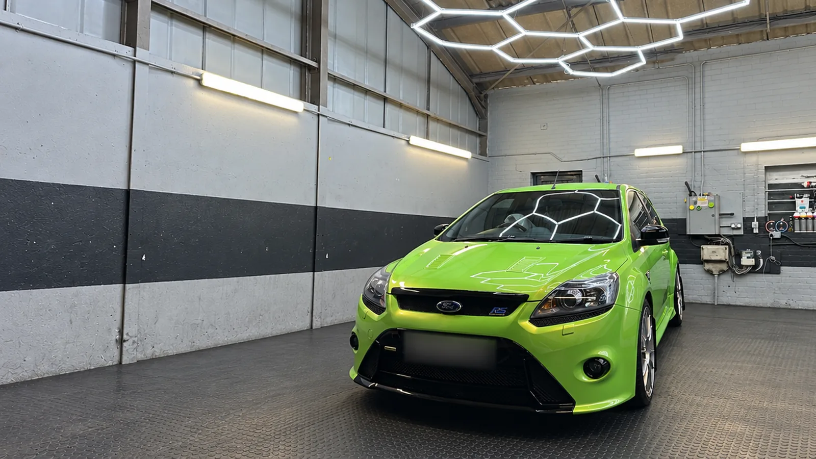 A green Ford Focus RS under the hexagon lighting in our Braintree studio