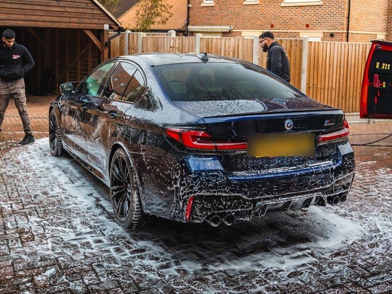Mobile valet in progress, snow foam being applied on a customer's driveway